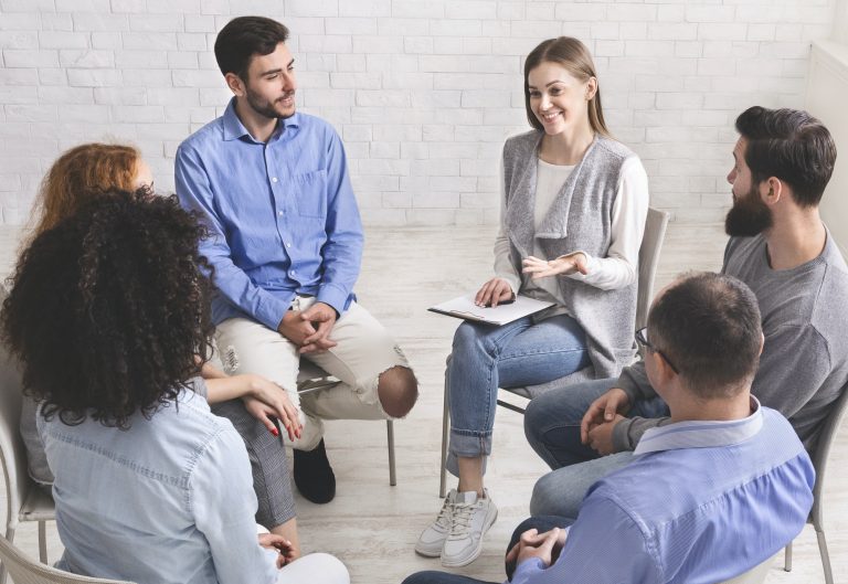 psychotherapist-talking-with-patients-of-support-group